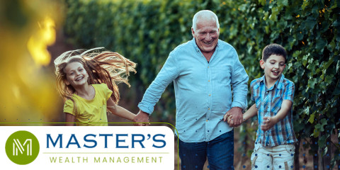 A grandfather skips, hand-in-hand, with two children. 