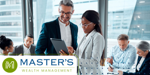 High-income professionals reviewing tax changes on a clipboard together, with other professionals in business attire, men and women, seated at a conference table behind them. 