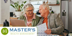 Retirees looking at the tax changes from 2025 on a sheet of paper while working on a laptop.